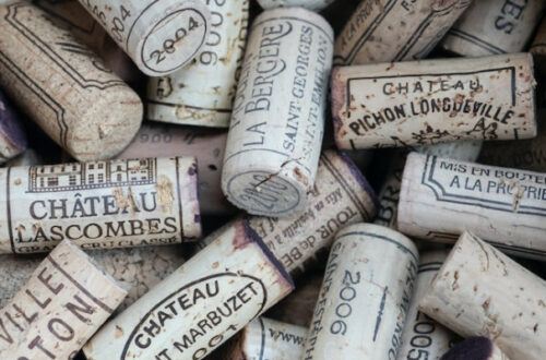 When are Bordeaux wines determined to be Grand Cru or Grand Cru Classe?
