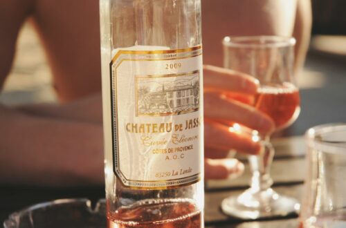 Cinsault Grape Variety In Provence - a bottle of rosé wine with a glass of rosé wine